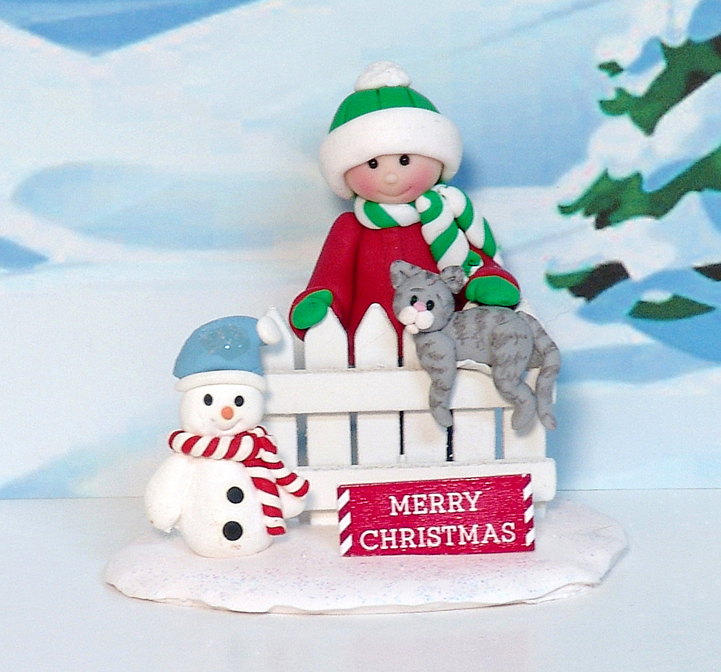 Little kid with Gray Kitty Cat on Fence